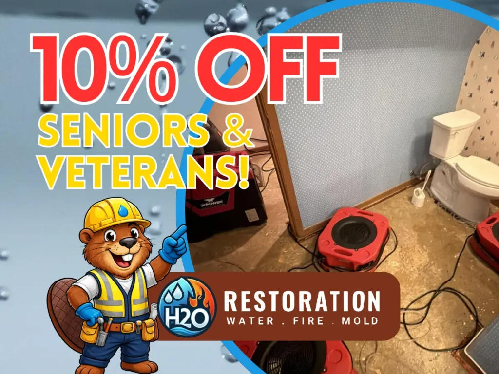 H2O Restoration Water Fire Mold promotional graphic offering 10% off for seniors and veterans, featuring the company's beaver mascot in a hard hat and tool vest alongside a water-damaged bathroom with drying equipment