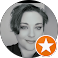 Circular black and white profile photo of a woman with an orange star badge overlay, used as a customer review or testimonial avatar